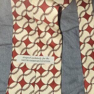 This tie is a novelty / collectible necktie with a repeating baseball motif.
